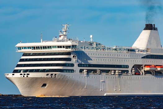 White cruise liner sailing on a clear day