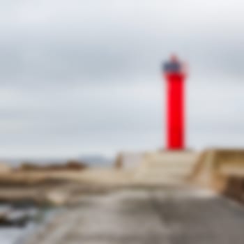 Red lighthouse - soft lens bokeh image. Defocused background