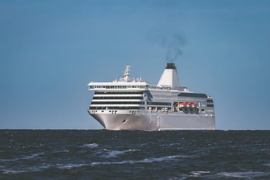 White cruise liner sailing on a clear day