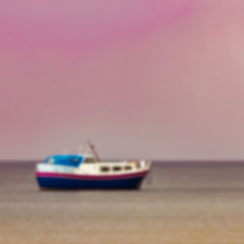 Blue passenger ship - soft lens bokeh image. Defocused background