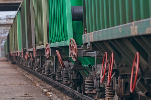 Green cargo wagons. Freight train in action