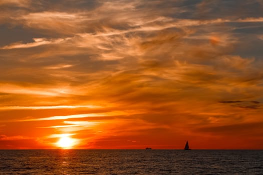 Hot and romantic sunset over the Baltic sea. Calm landscape