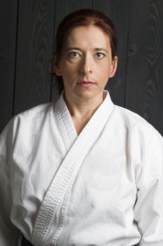 portrait of a forty year old woman wearing a gi