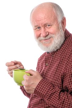 Cheerful and smiling handsome bald and bearded senior man with big green cup, isolated on white background