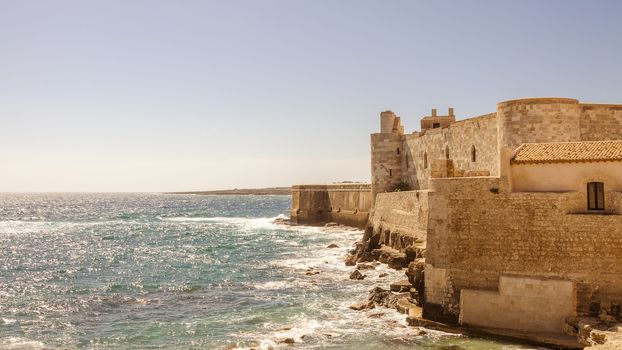 Detail of the wall on the sea of medieval Maniace's Castle in Siracusa