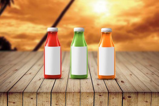 three multicolored bottles of juice are on the counter