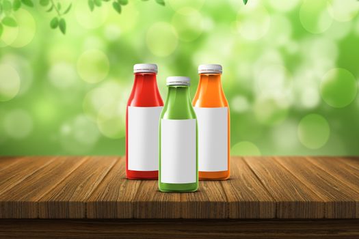 three multicolored bottles of juice are on the counter