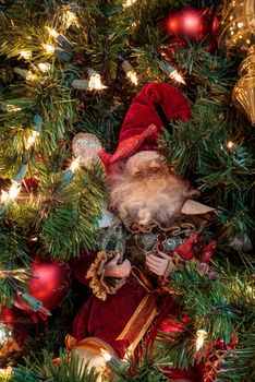 Christmas ornaments and white lights on a Christmas tree during the holiday season