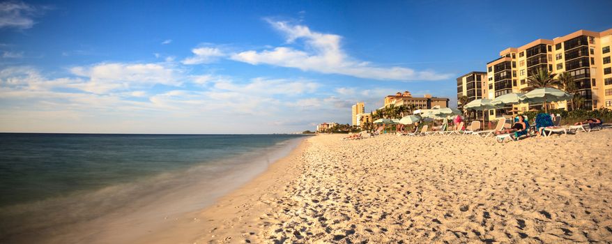 White sand and palm trees along Vanderbilt Beach in Naples, Florida, USA