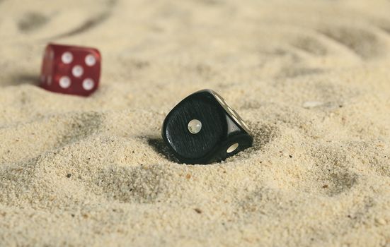 some dices in the sand dunes