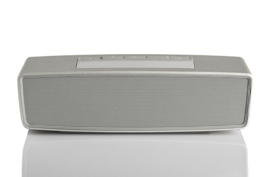 Isolated little  portable grey speaker