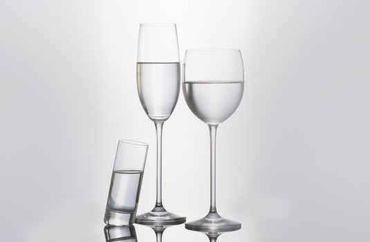Isolated glass  and cup of water