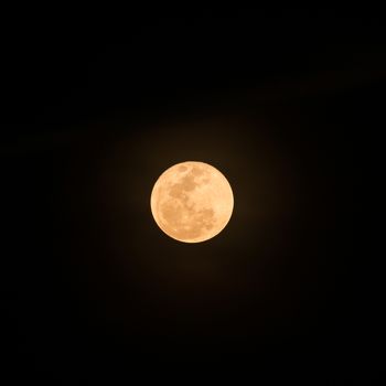 Big fullmoon on dark sky seen from Bangkok,Thailand 