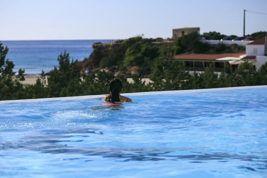 Woman in infinete pool