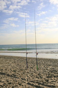 two Fishing rods  on the beach