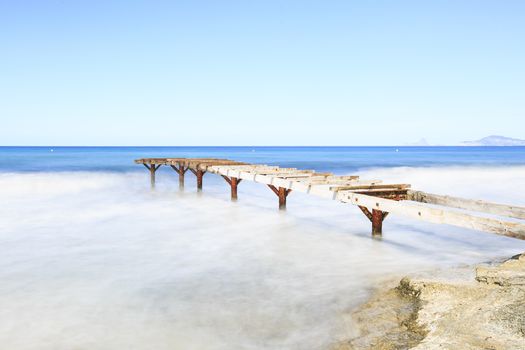 Formentera beach old wooden bridge