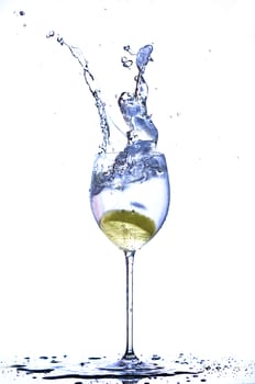 Splash into glass of water lemon