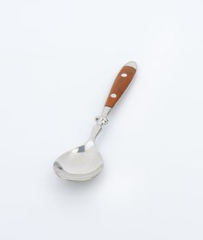 Empty table spoon with wooden handle