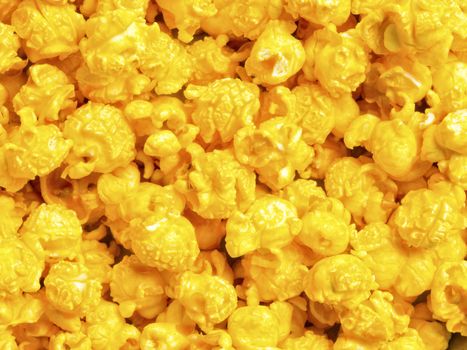 close up of golden cheese popcorn food background