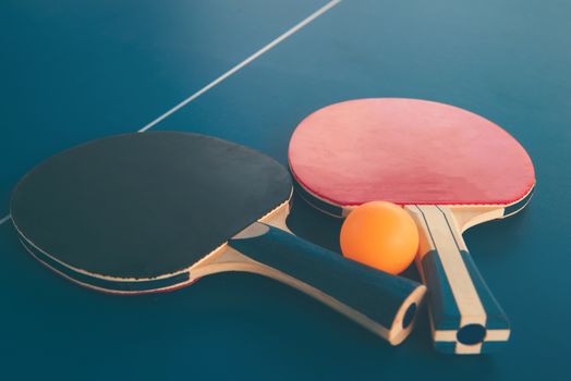 Tabletennis or ping pong rackets and balls on table. Sport concept.