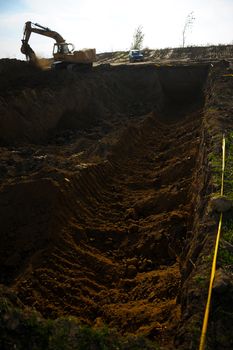 Big excavator in action on construction site