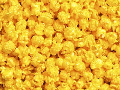close up of golden cheese popcorn food background