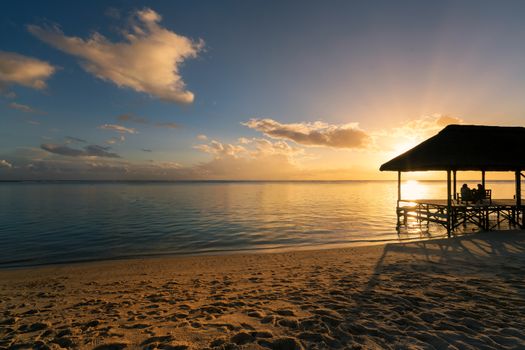 Relaxing on remote Paradise beach at sunset ,"Flic an flac" beach,Mauritius island.