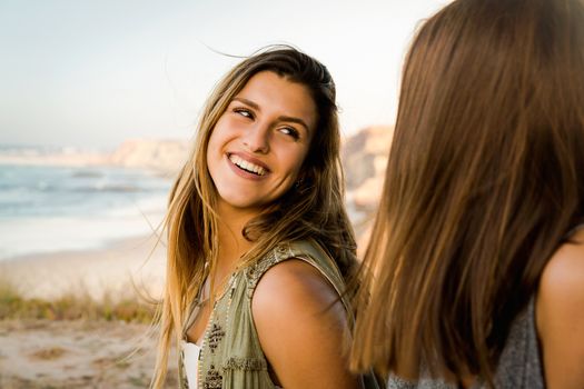 Two best friends near a beach having a good time