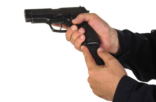 Close up view on gun in the hand on white background