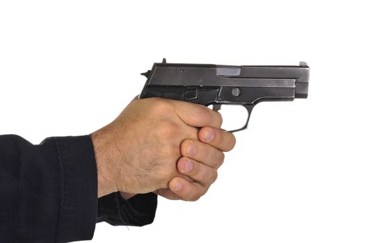 Close up view on gun in the hand on white background