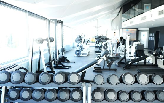 View on modern empty large gym with lot of weights