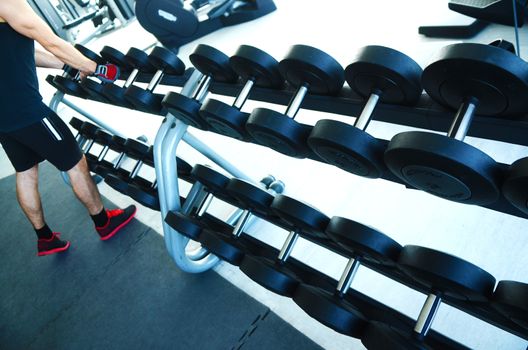 View on modern empty large gym with lot of weights