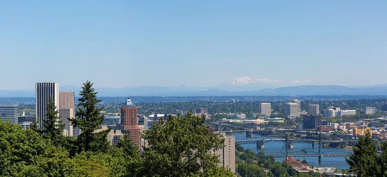 Portland Oregon downtown cityscape with bridges over Willamette River and Mt Saint Helens view panorama