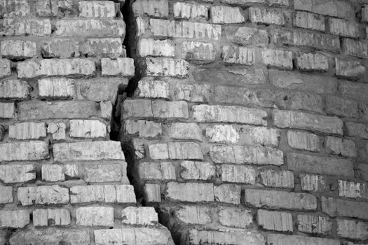cracked brick wall. damage of war concept