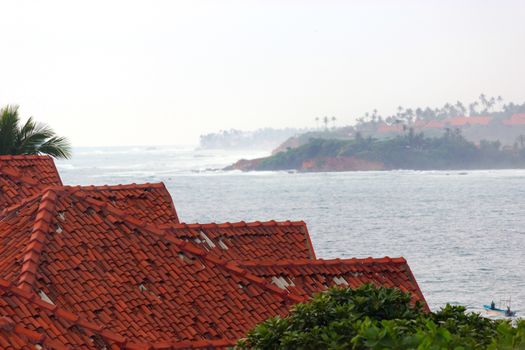 ocean view luxury House with red roof on the beach