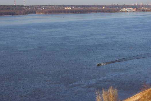 Aerial view on wide Volga River with Motorboats