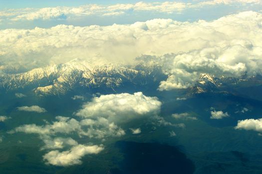 white clouds below. aerial view from a plane