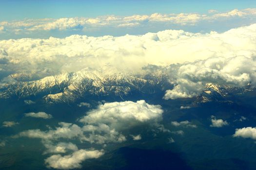 white clouds below. aerial view from a plane