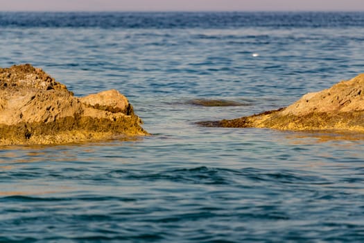 The rocks and the blue Mediterranean sea