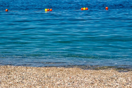 Sand the rocks and a blue Mediterranean sea