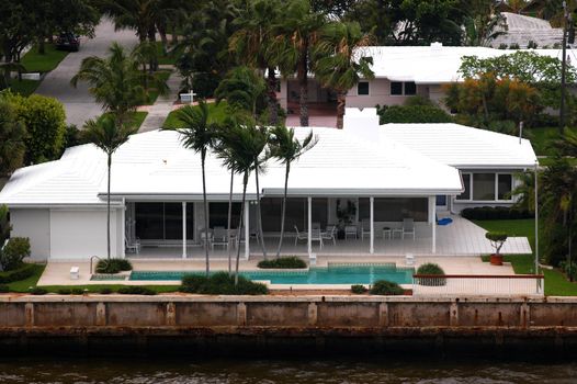 High angle view on house with palms and pool