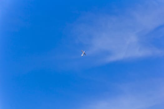 Photo of flying military airplane in blue sky