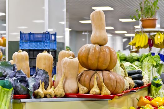 Counter with different fresh vegetable in marketplace