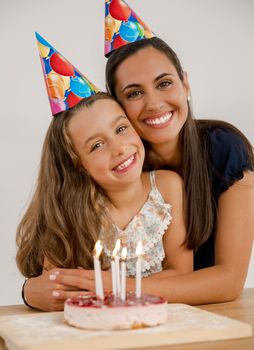 Shot of a mother and daughter in the kitchen celebrating Daughter's birthday