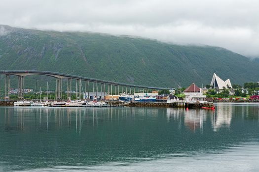 Artic cathedral and bridge in Tromso in a cloudy day, Norway