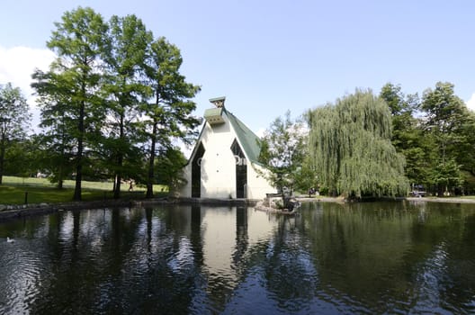 View on beautiful green park with small lake