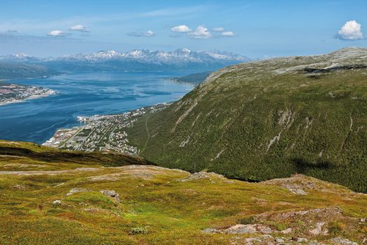 Mountains view and fjord in Tromso seen from the top of a mountain, Norway