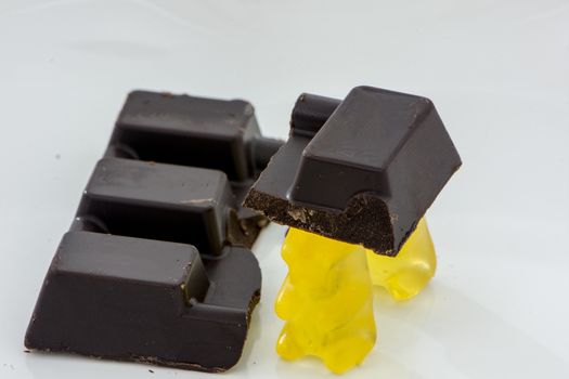 slice of the black chocolate carried by yellow gummy bears