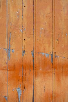 Old wood board painted orange, background texture