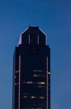 top part of the glass office building during the evening time